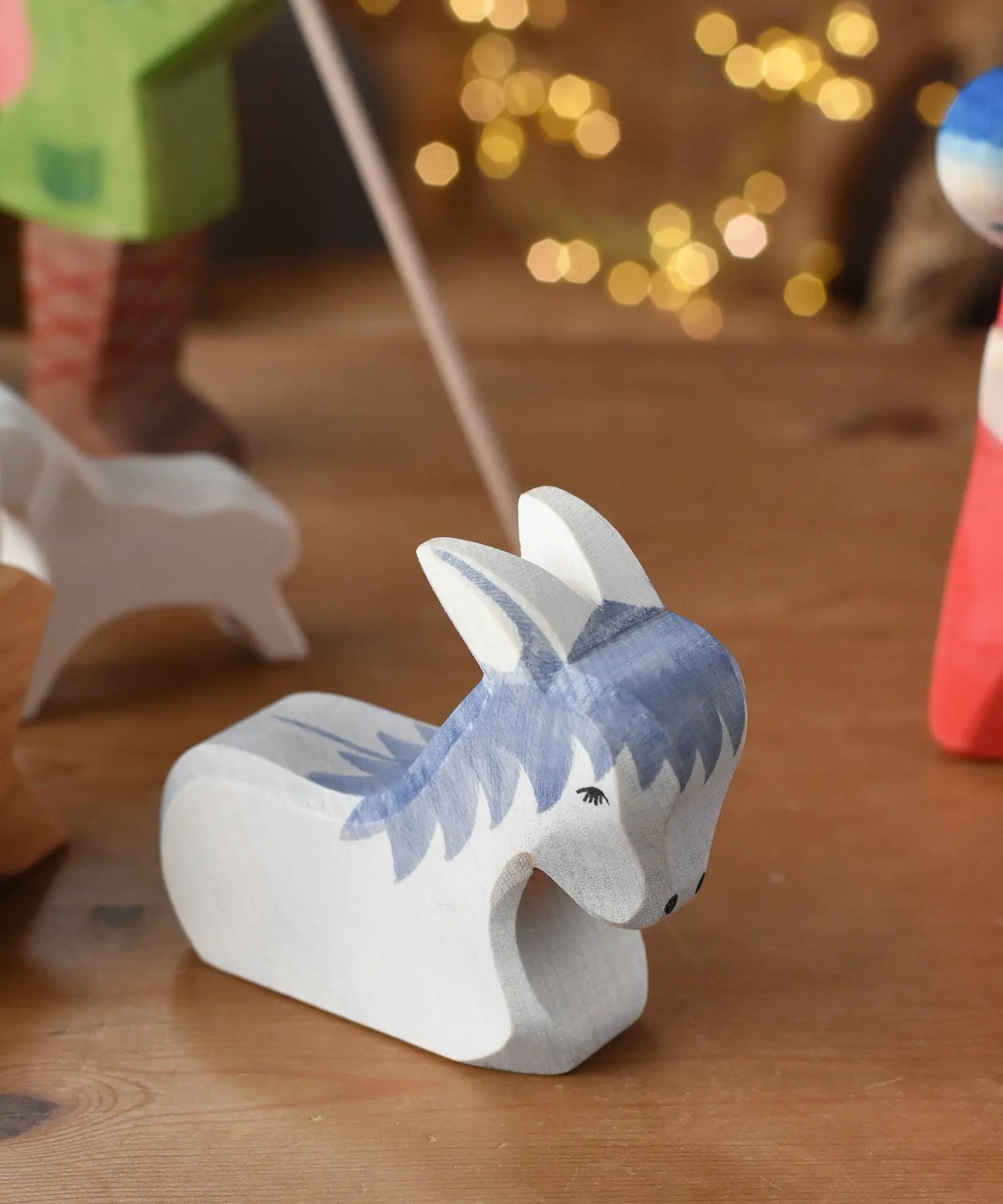 Ostheimer donkey wooden toy from the nativity set with cardboard diorama scene. 