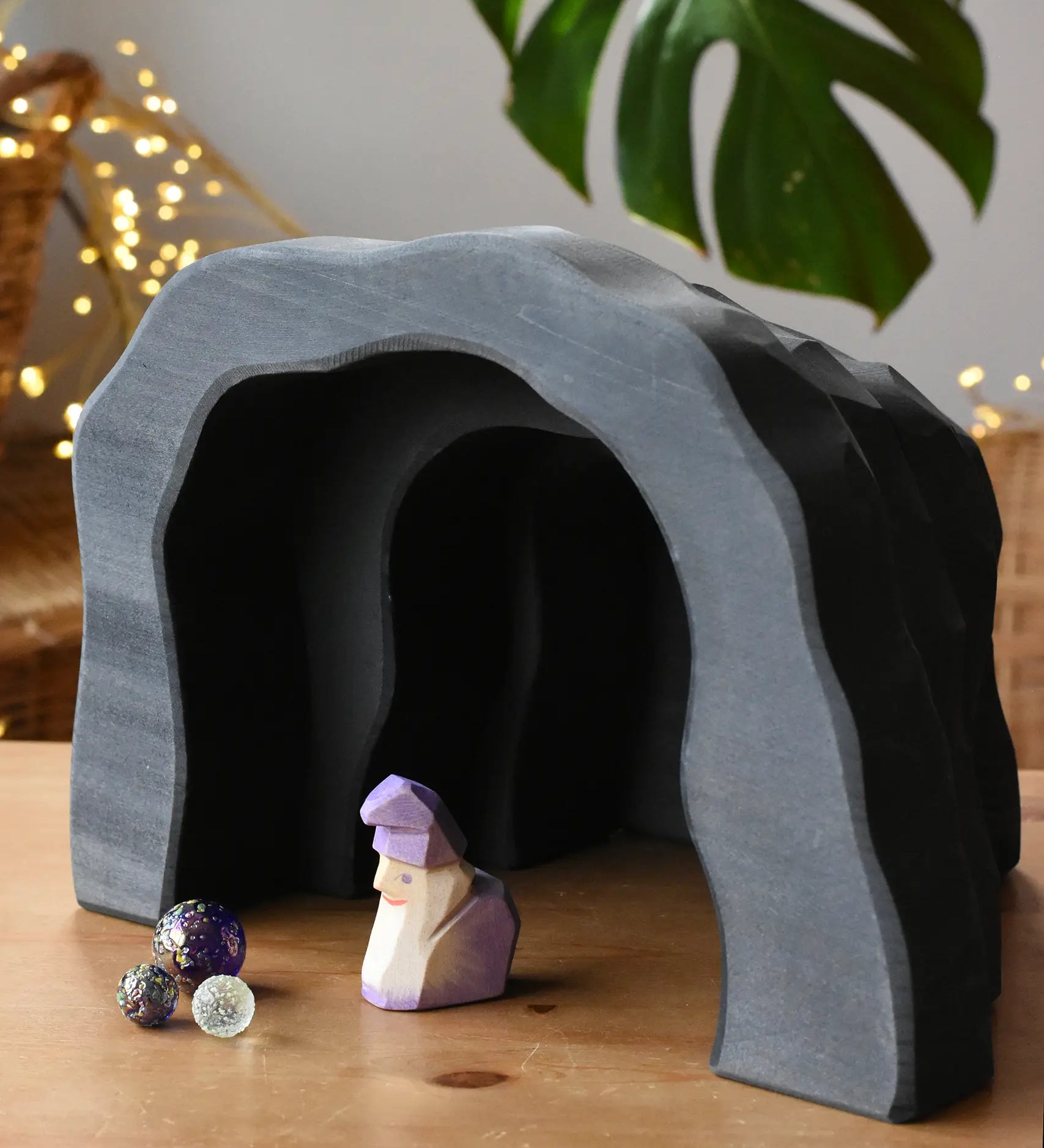 Ostheimer dragon's cave with an amethyst dwarf placed inside with billes glass marbles. 