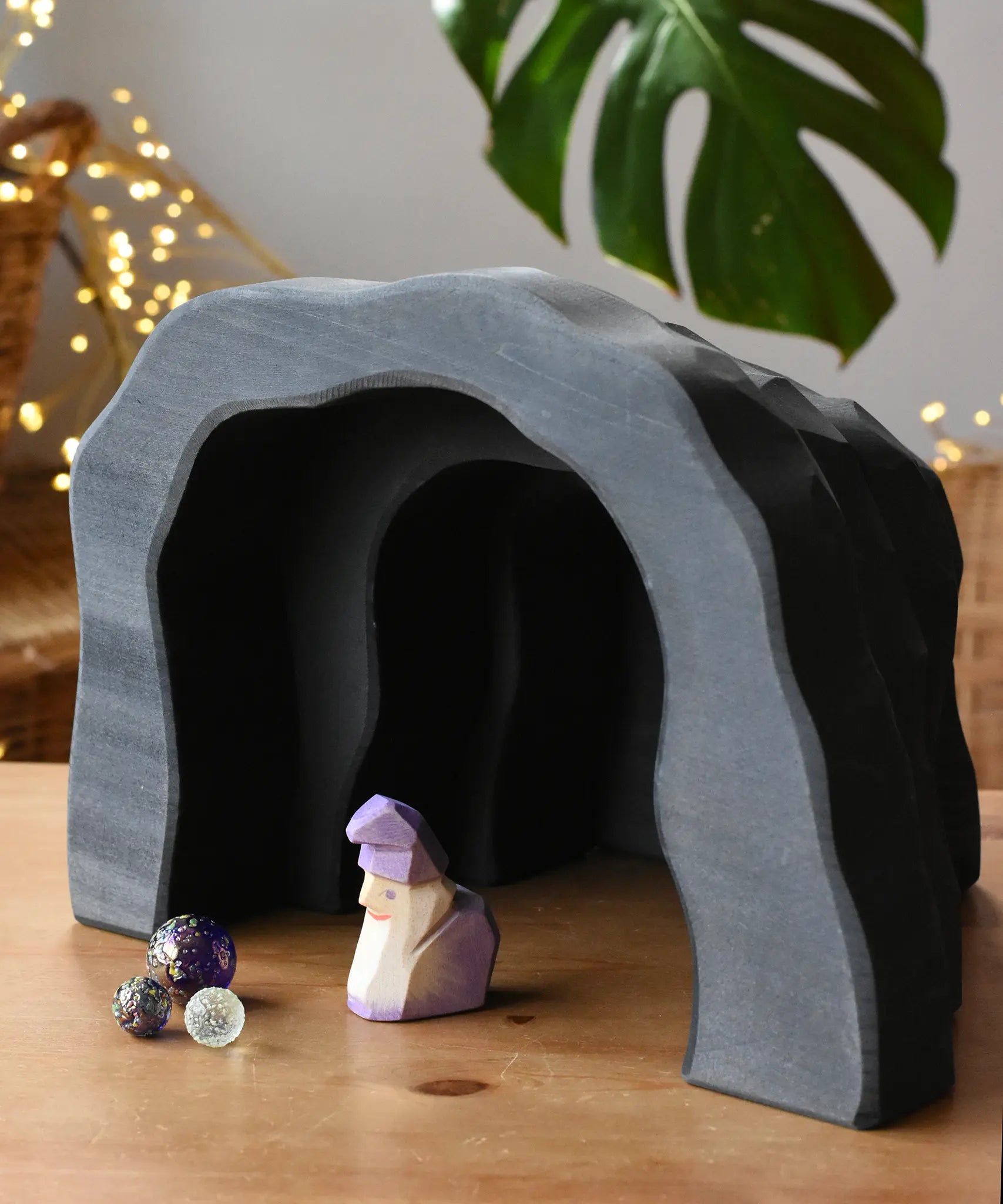 Ostheimer dragon's cave with an amethyst dwarf placed inside with billes glass marbles. 