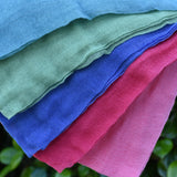 Close up of the Ostheimer Fairytale decoration scarves play cloths draped over a child's arm.