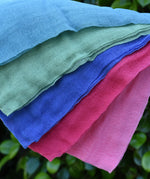 Close up of the Ostheimer Fairytale decoration scarves play cloths draped over a child's arm.