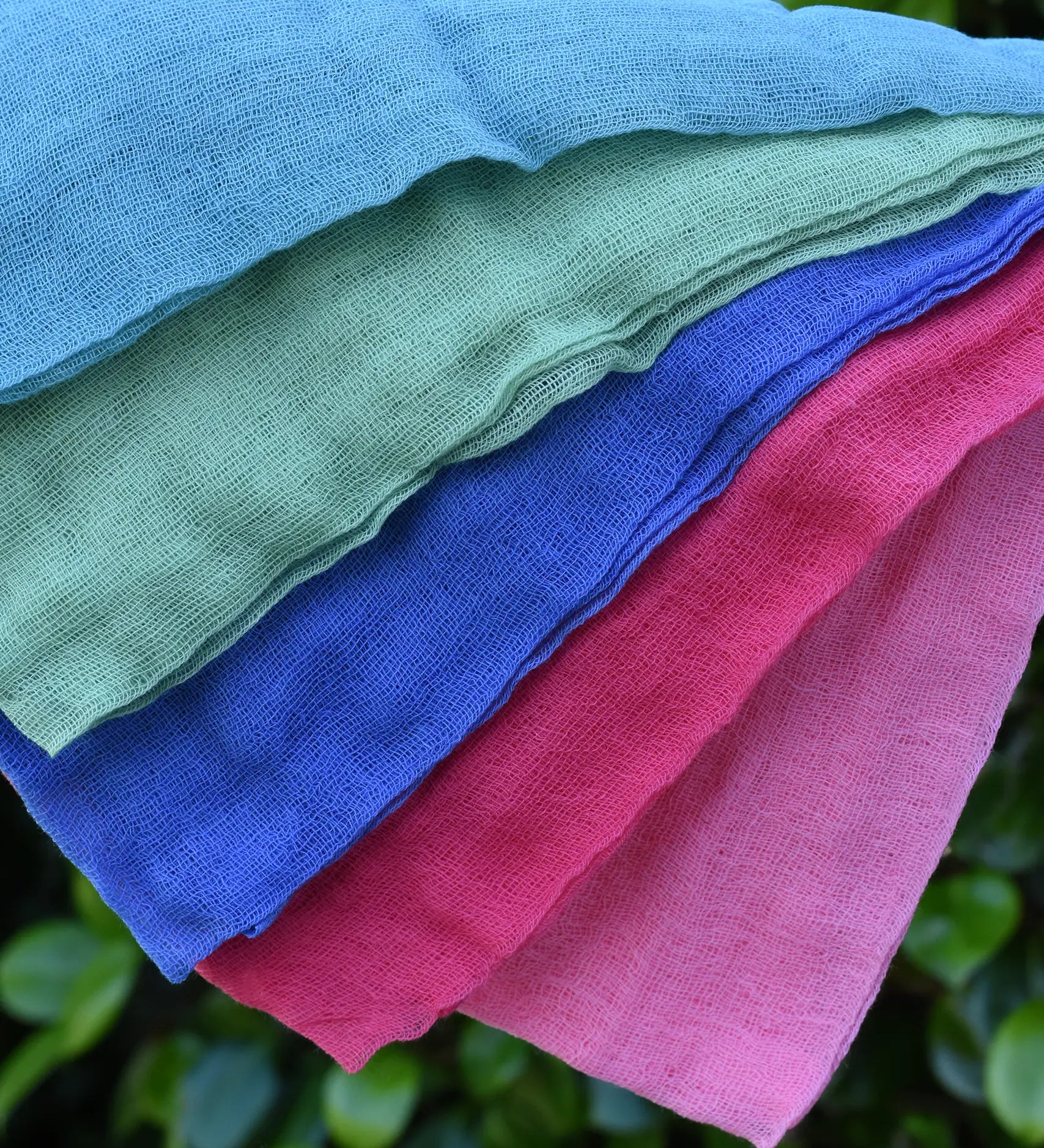 Close up of the Ostheimer Fairytale decoration scarves play cloths draped over a child's arm.