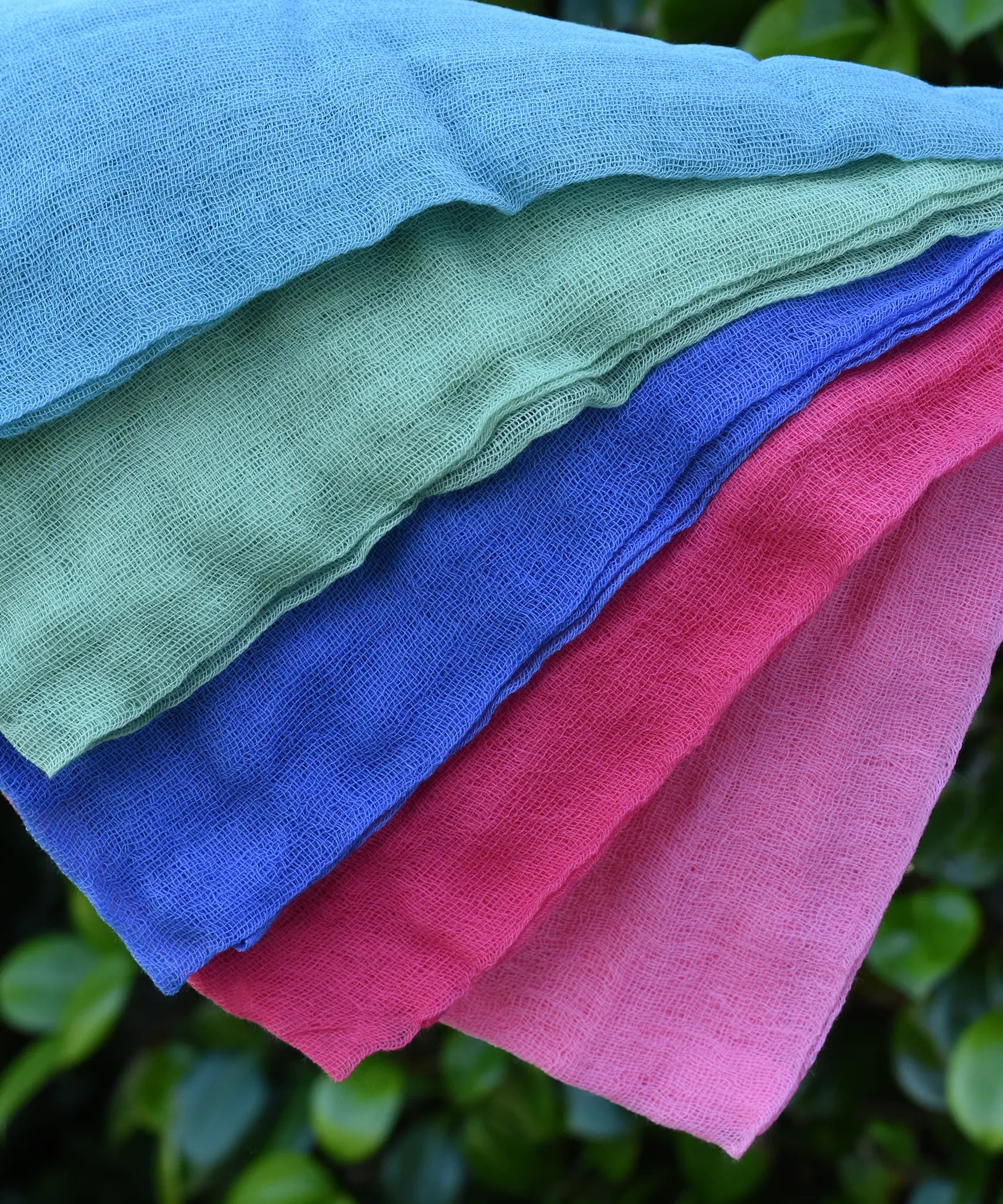 Close up of the Ostheimer Fairytale decoration scarves play cloths draped over a child's arm.