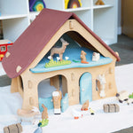 Ostheimer wooden farm house with light red roof and light blue doors