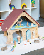 Ostheimer wooden farm house with light red roof and light blue doors
