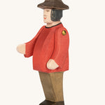 Ostheimer Farmer Man on a plain background. The wooden toy figure has movable arms and has a painted red top. 