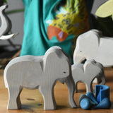 Ostheimer female elephant cow wooden toy figure placed in a small world play scene with loose parts from Babipur. 