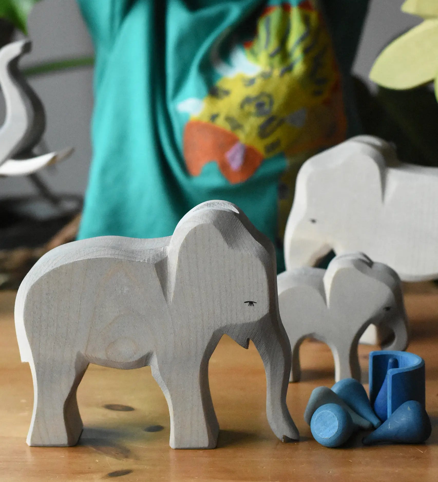 Ostheimer female elephant cow wooden toy figure placed in a small world play scene with loose parts from Babipur. 