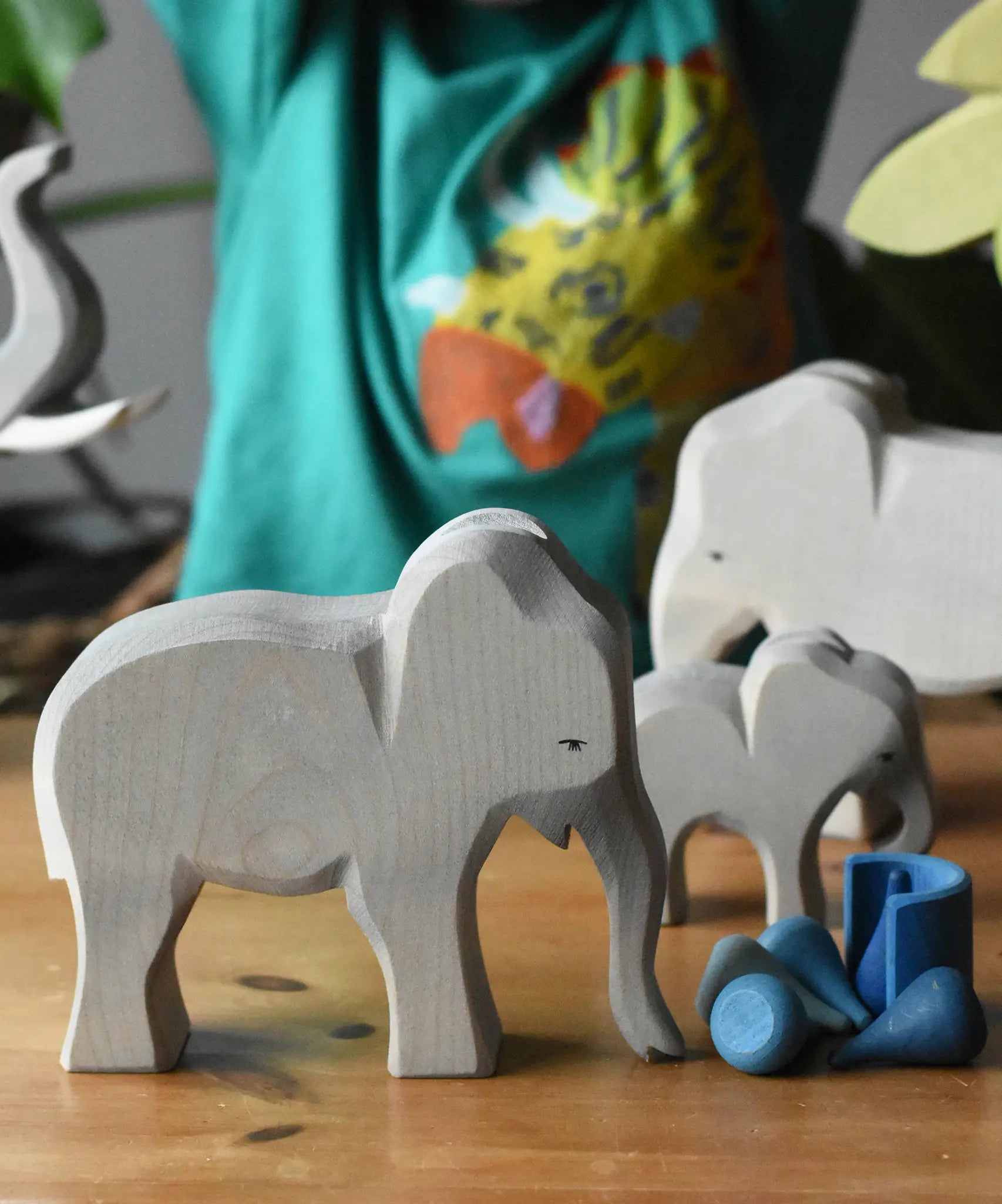 Ostheimer female elephant cow wooden toy figure placed in a small world play scene with loose parts from Babipur. 
