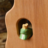 Ostheimer frog king wooden toy figure placed in a widow in the Ostheimer tower. 