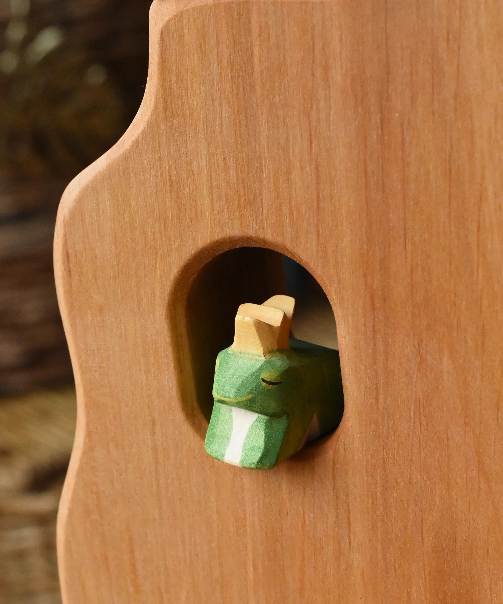 Ostheimer frog king wooden toy figure placed in a widow in the Ostheimer tower. 