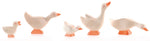 A gaggle of Ostheimer wooden geese and goslings lined up.