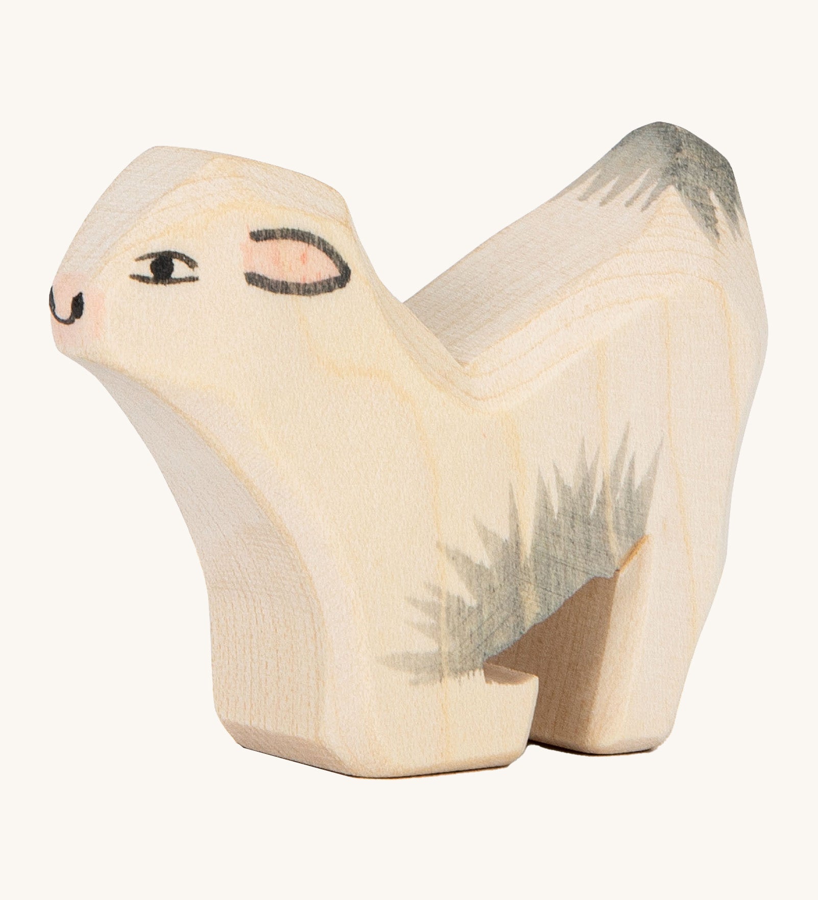 Ostheiemer goat kid wooden figure. A handmade and hand painted goat kid figure kneeling down to drink