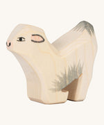 Ostheiemer goat kid wooden figure. A handmade and hand painted goat kid figure kneeling down to drink