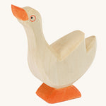 Ostheimer Goose with it's head held high on a plain background.