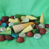 Close up of the pieces included in the Grapat x Ostheimer Hrókur Mandala Pieces wooden toy set.