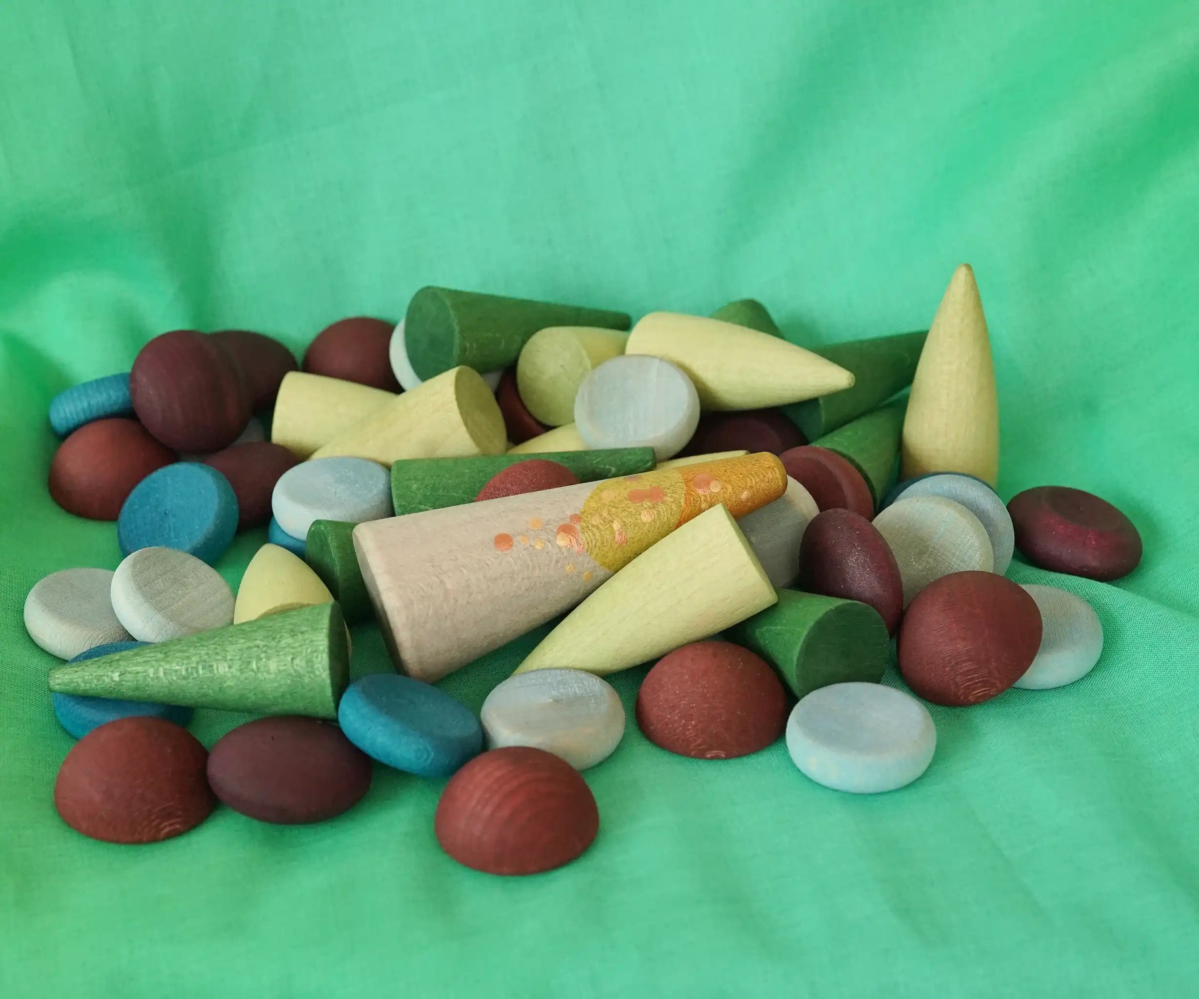 Close up of the pieces included in the Grapat x Ostheimer Hrókur Mandala Pieces wooden toy set.