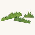 Ostheimer green wooden grass figures on a plain background. There a 3 grass pieces in the set, small, medium and large lengths. 