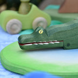 Ostheimer crocodile wooden toy figure, close up of the hand  painted features on the face. 