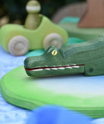 Ostheimer crocodile wooden toy figure, close up of the hand  painted features on the face. 
