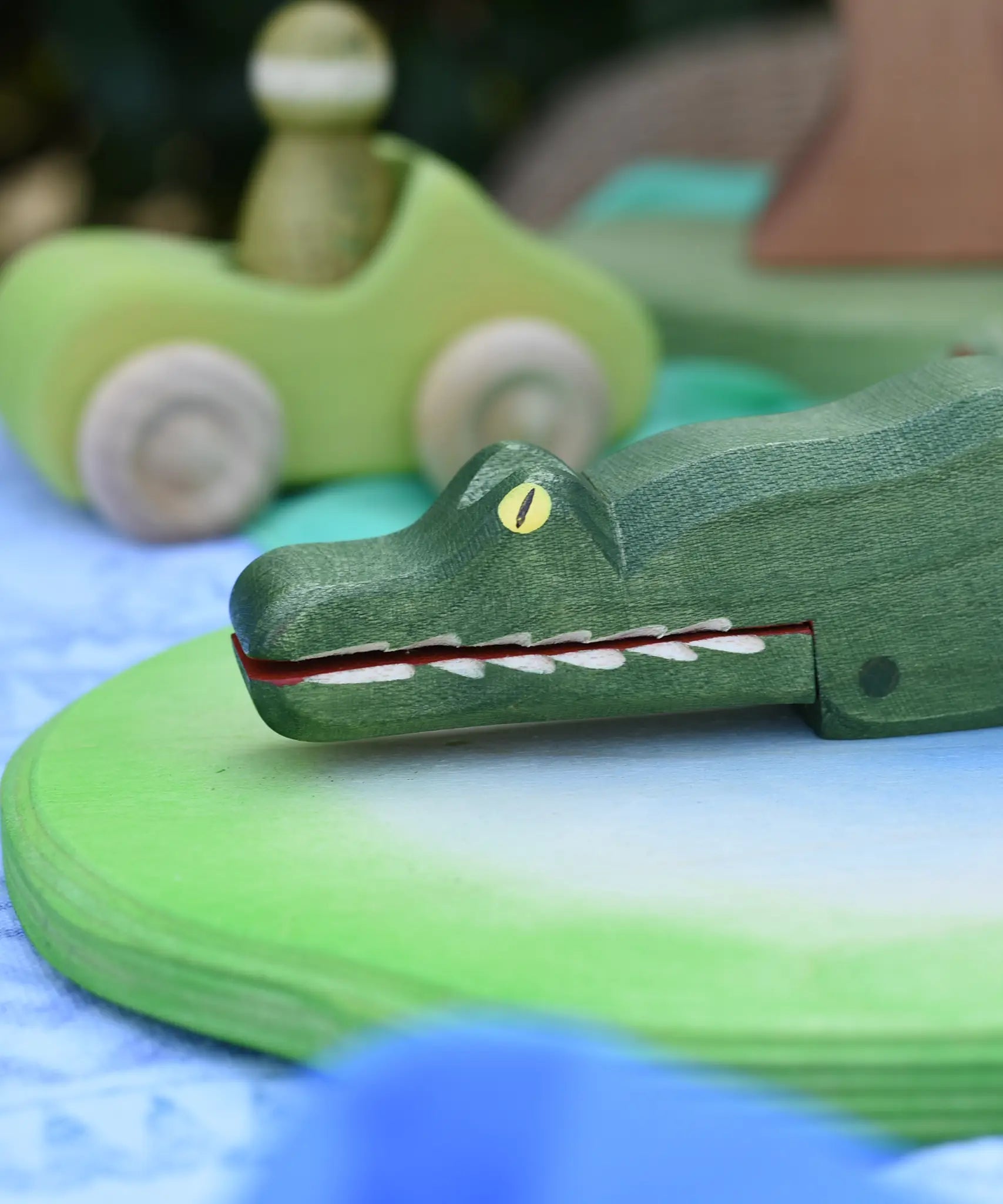 Ostheimer crocodile wooden toy figure, close up of the hand  painted features on the face. 