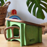 Ostheimer green hutch for toy animals placed on a wooden surface with Babipur Lanka Kade exclusive toys in the background.