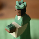 Close up of the Ostheimer green king wooden toy figure . 