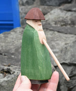 Ostheimer green shepherd with staff in an adult's hand. 
