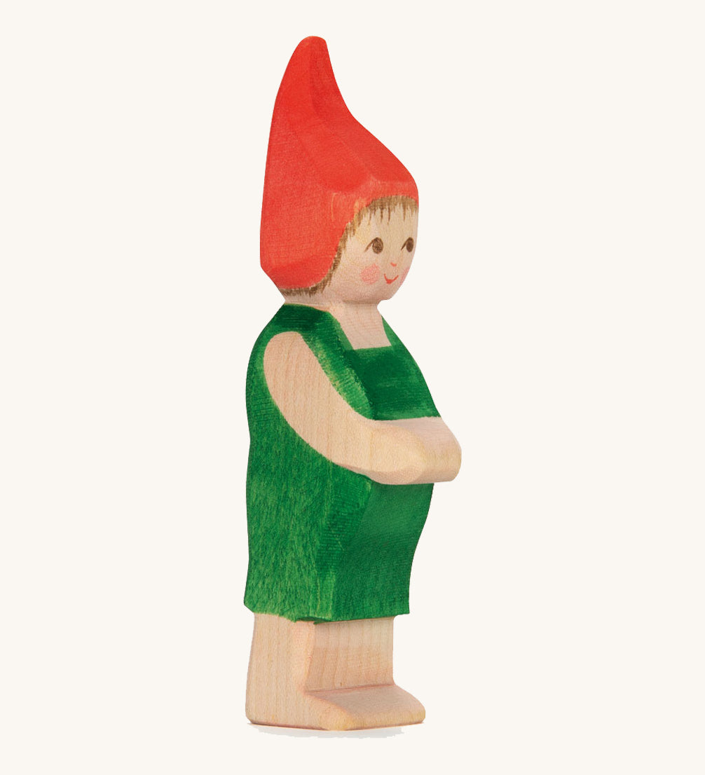 The Ostheimer hand made wooden 'Pepe' character figure from the German story “Pepe and Sumselinchen”. He has green overalls and a pointy red hat.
