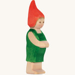 The Ostheimer hand made wooden 'Pepe' character figure from the German story “Pepe and Sumselinchen”. He has green overalls and a pointy red hat.