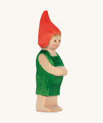 The Ostheimer hand made wooden 'Pepe' character figure from the German story “Pepe and Sumselinchen”. He has green overalls and a pointy red hat.