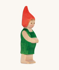 The Ostheimer hand made wooden 'Pepe' character figure from the German story “Pepe and Sumselinchen”. He has green overalls and a pointy red hat.