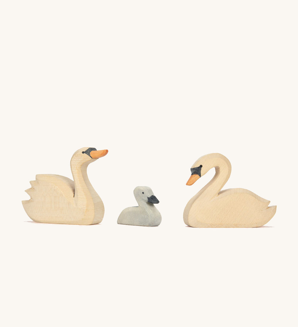 Three Ostheimer hand made wooden swan figures.