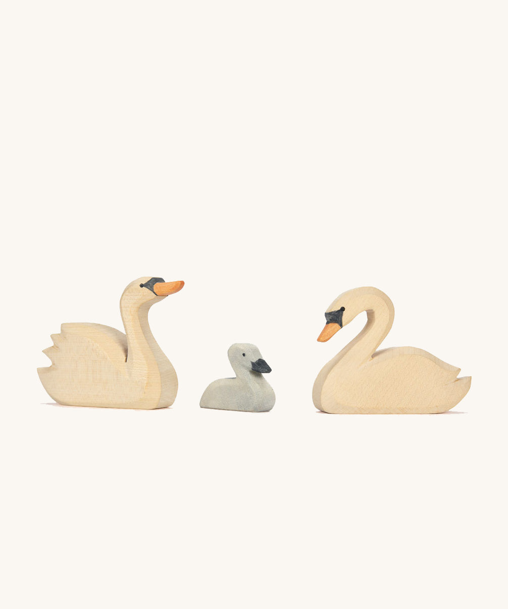 Three Ostheimer hand made wooden swan figures.