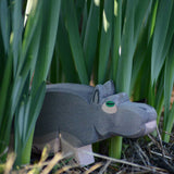 An Ostheimer hippopotamus placed among greenery outdoors. 