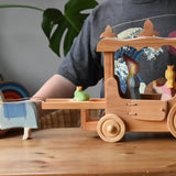 Ostheimer wooden white horse with saddle placed at the front of the stage coach with the rope attachment around it's front. Medieval and frog prince princesses are inside the coach.
