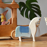 Ostheimer wooden white horse with saddle placed in front of the stage coach.