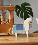Ostheimer wooden white horse with saddle placed in front of the stage coach.