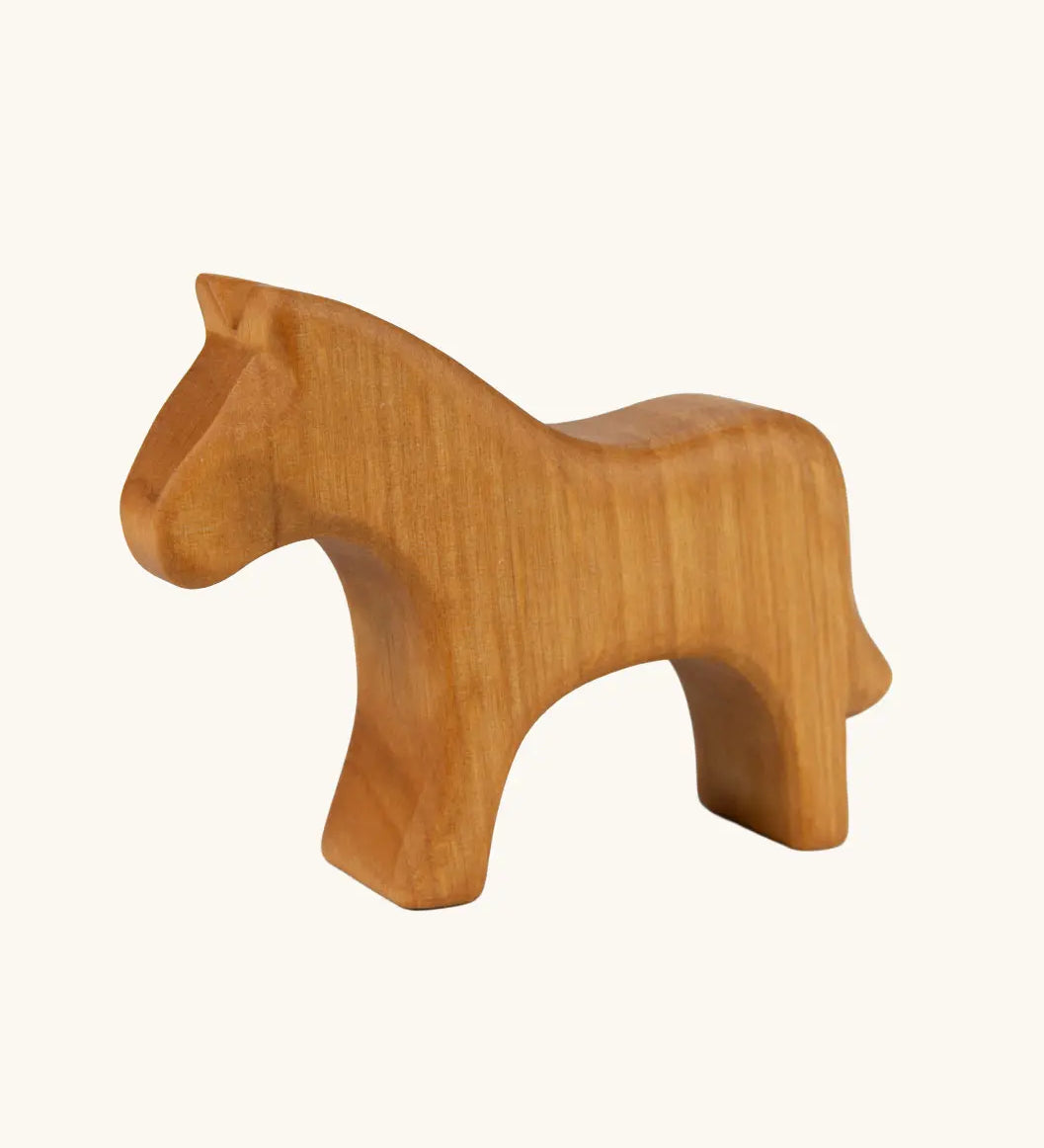 Ostheimer horse toy figure in a natural oiled wood showing the grain marks. 