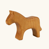 Ostheimer horse toy figure in a natural oiled wood showing the grain marks. 
