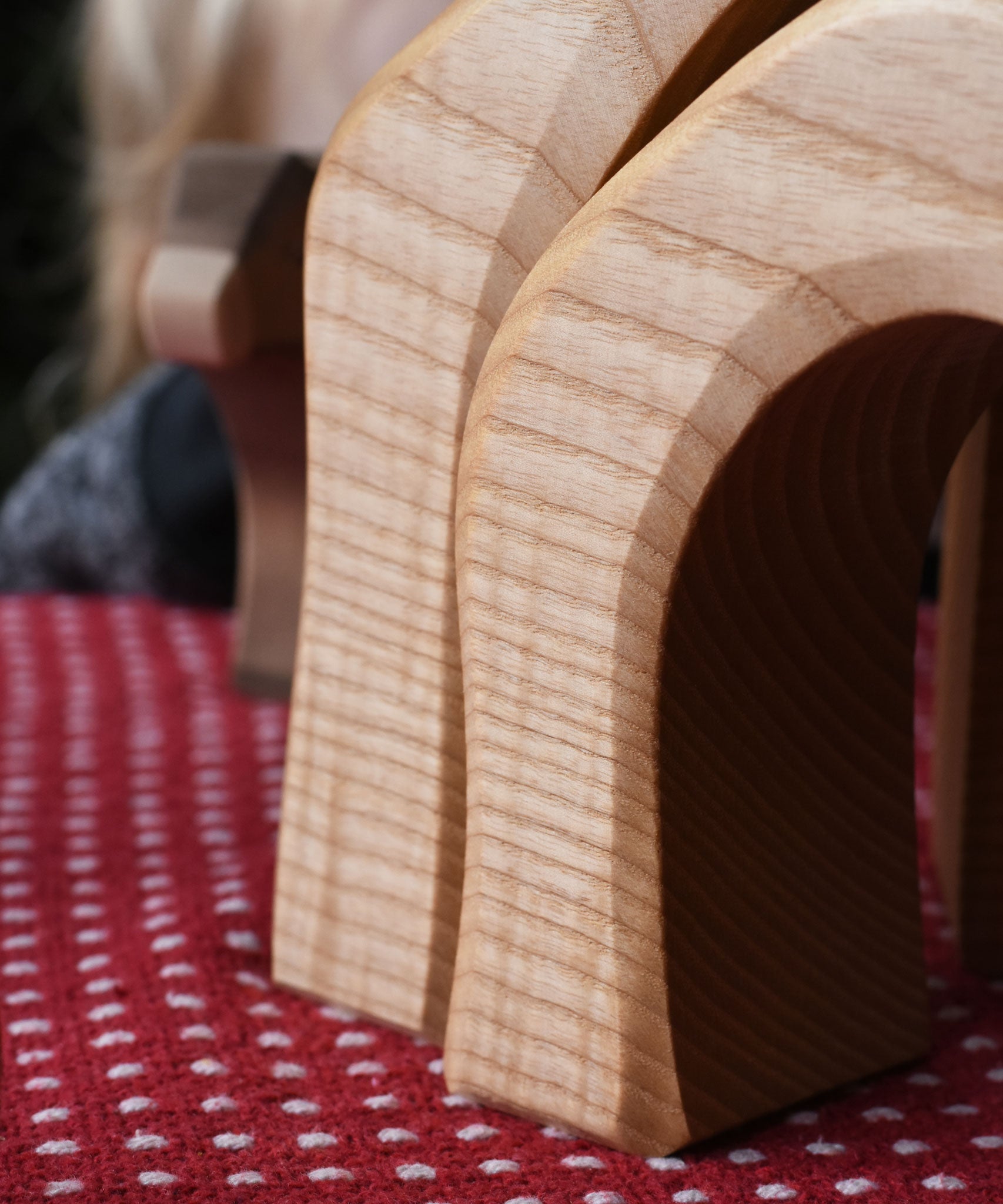 A close up of  wooden grain marks on the Ostheimer 4 Piece Wooden House Parts, all pieces are unique. Ostheimer have a range of wooden toy figures and scenery pieces that are perfect for small world play available at Babipur. 