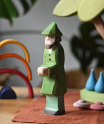 Ostheimer hunter wooden toy person figure placed in a small world play set up. 