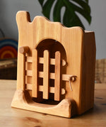 Ostheimer jailhouse wooden toy with the front trellised gate closed. 