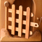 Close up of the trellised gate on the front of the Ostheimer jailhouse wooden toy.