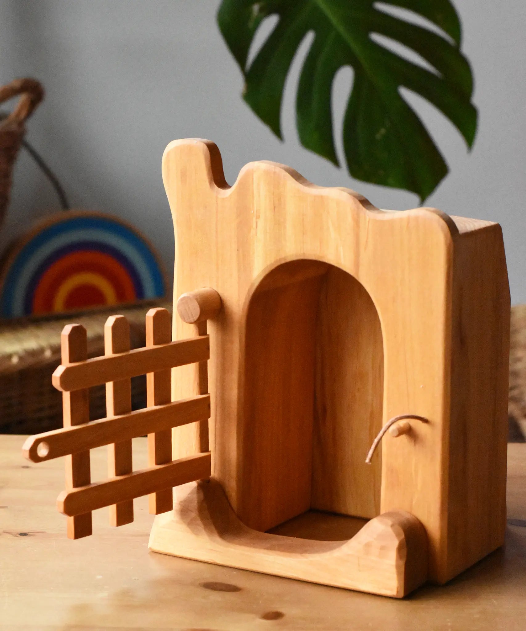 Ostheimer jailhouse wooden toy with it's front trellised gate open. 