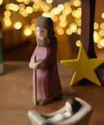 Ostheimer Joseph with staff handmade wooden toy figure in a small world play scene.