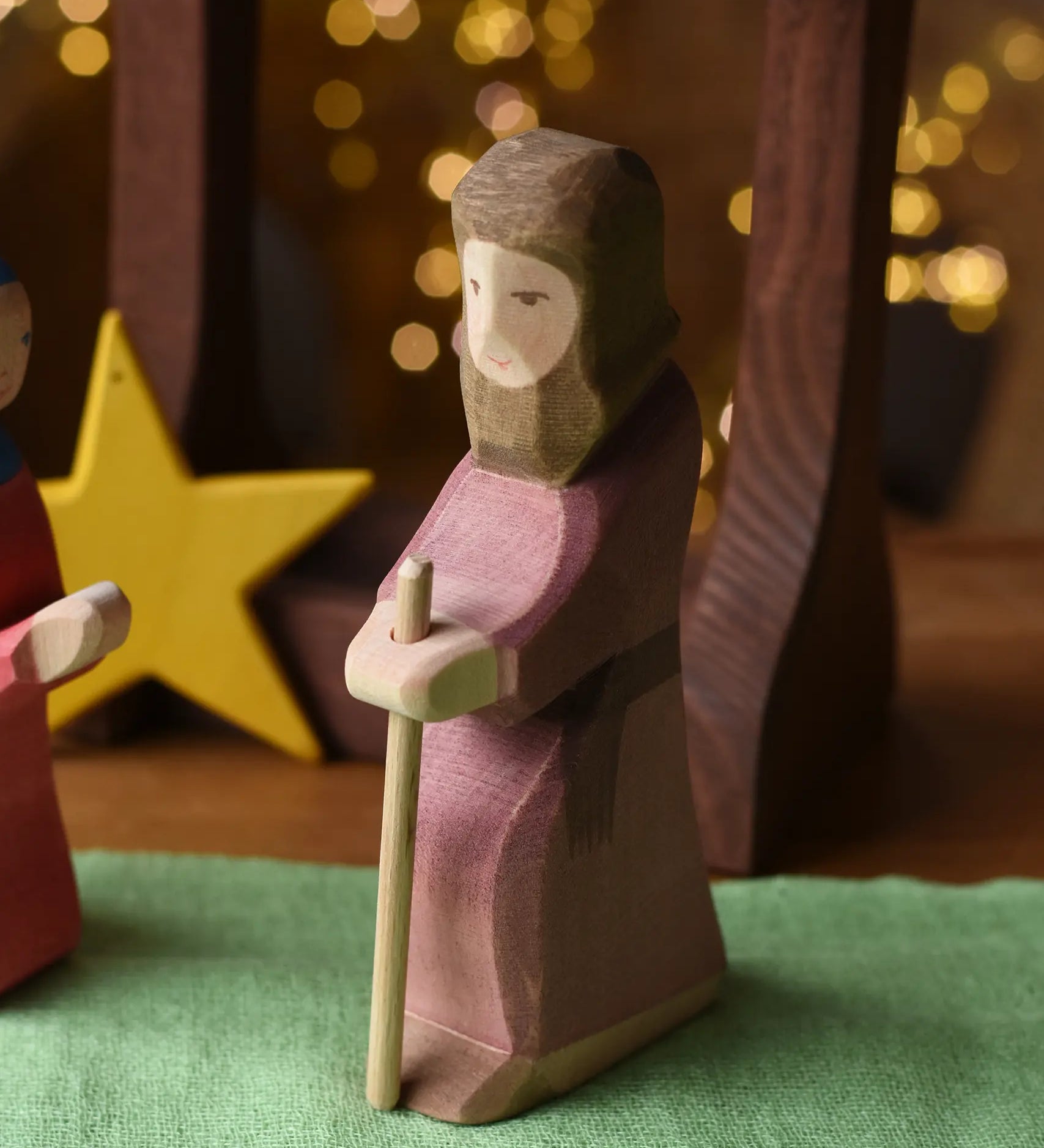 Ostheimer Joseph with staff handmade wooden toy figure in a small world play scene.