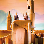 Close up of some Ostheimer toy knights stood on top the small world castle gates toy set