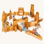 Ostheimer kids wooden castle toy set laid out on a cream background