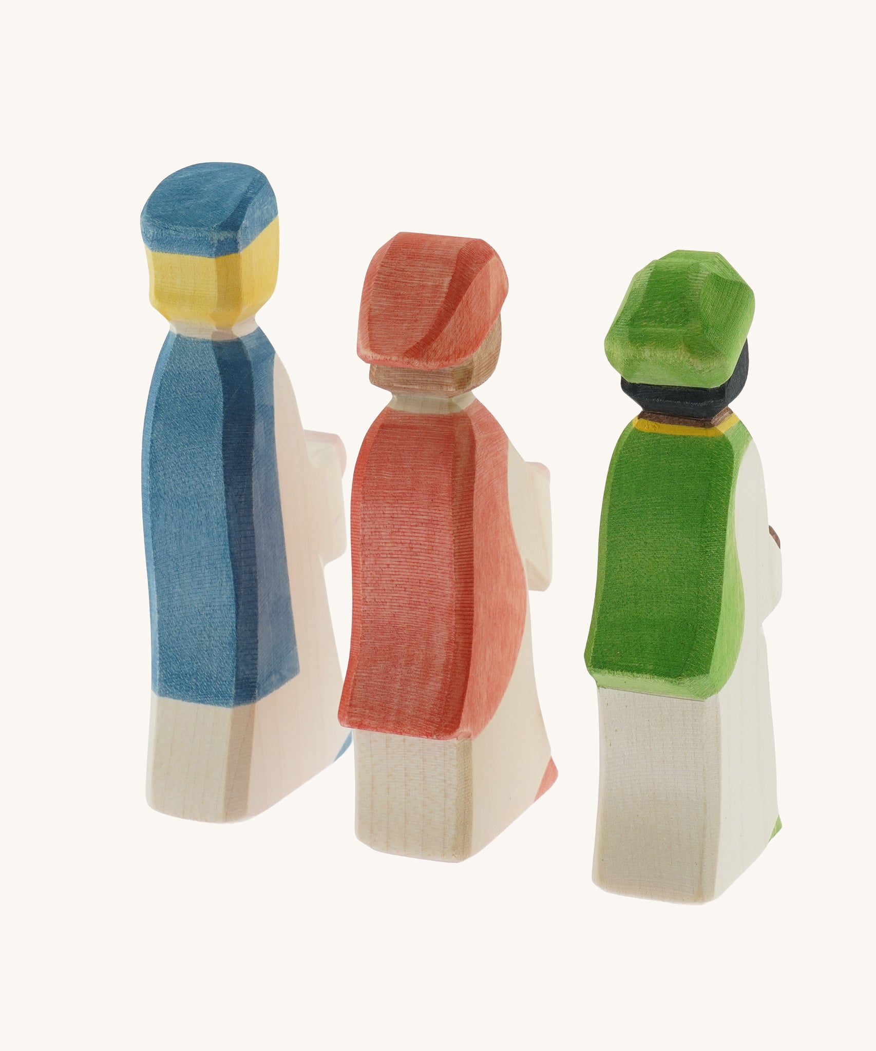The back of the collection of three Ostheimer  King's Page Three Wise Men Wooden Nativity Figures in green, blue and red outfits. These wooden figures are part of a wide range of expertly hand crafted wooden toys here at Babipur. 